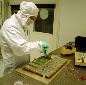 man in lab coat doing an experiment