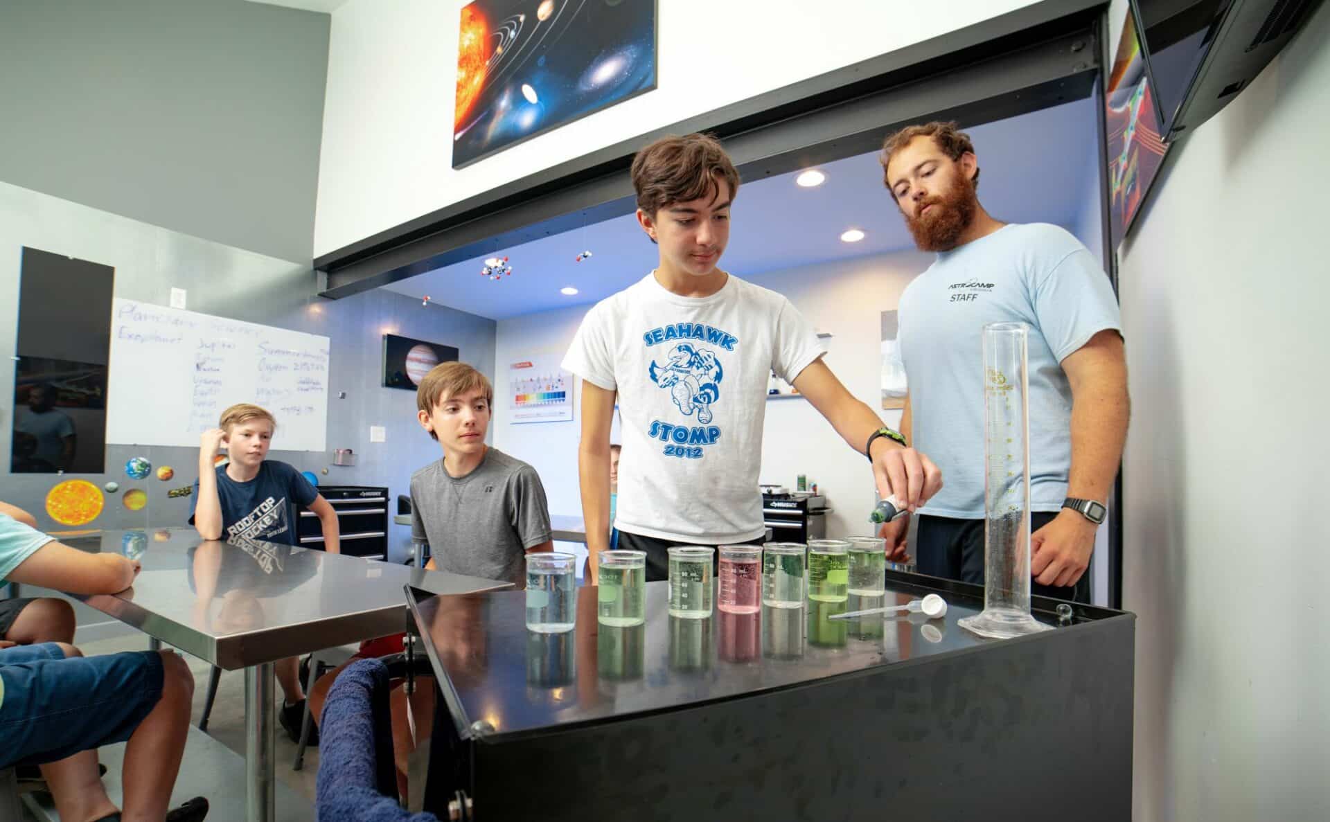 Students conducting an experiment using beakers.