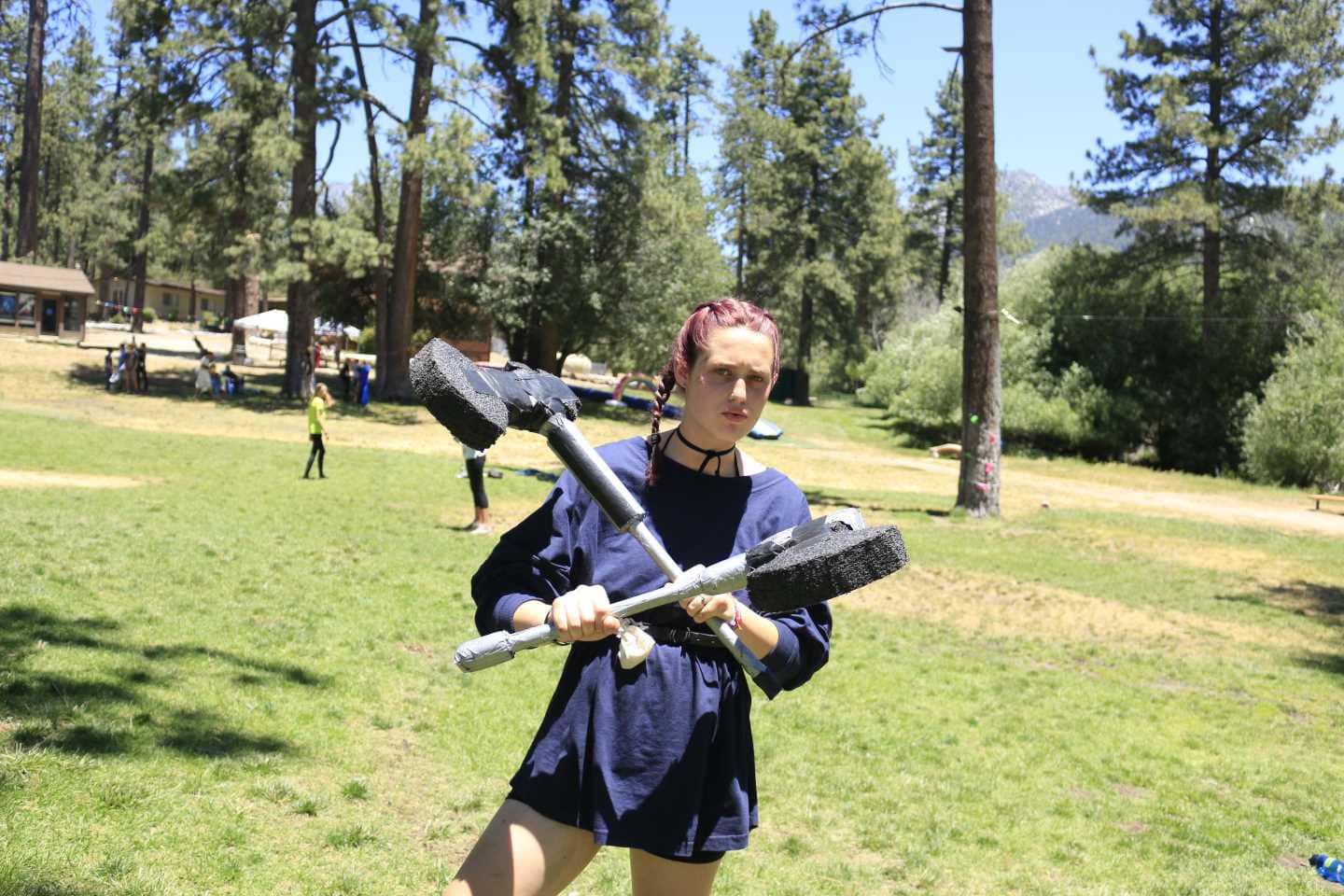 Girl holding two axes.