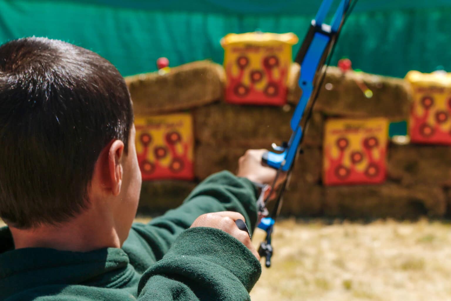 Boy shooting arrow.
