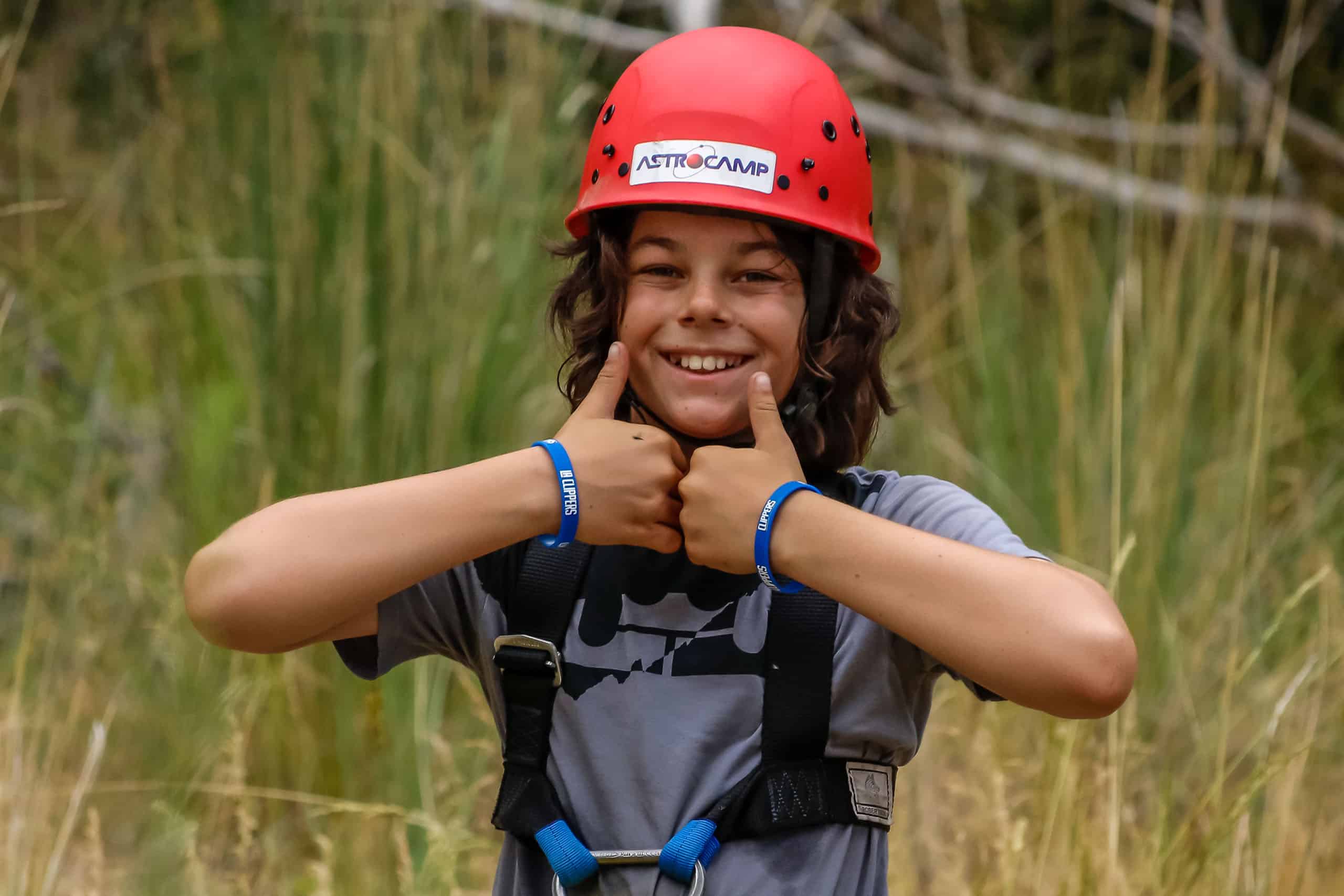 https://astrocamp.org/app/uploads/2022/03/boy-thumbs-up-helmet.jpg