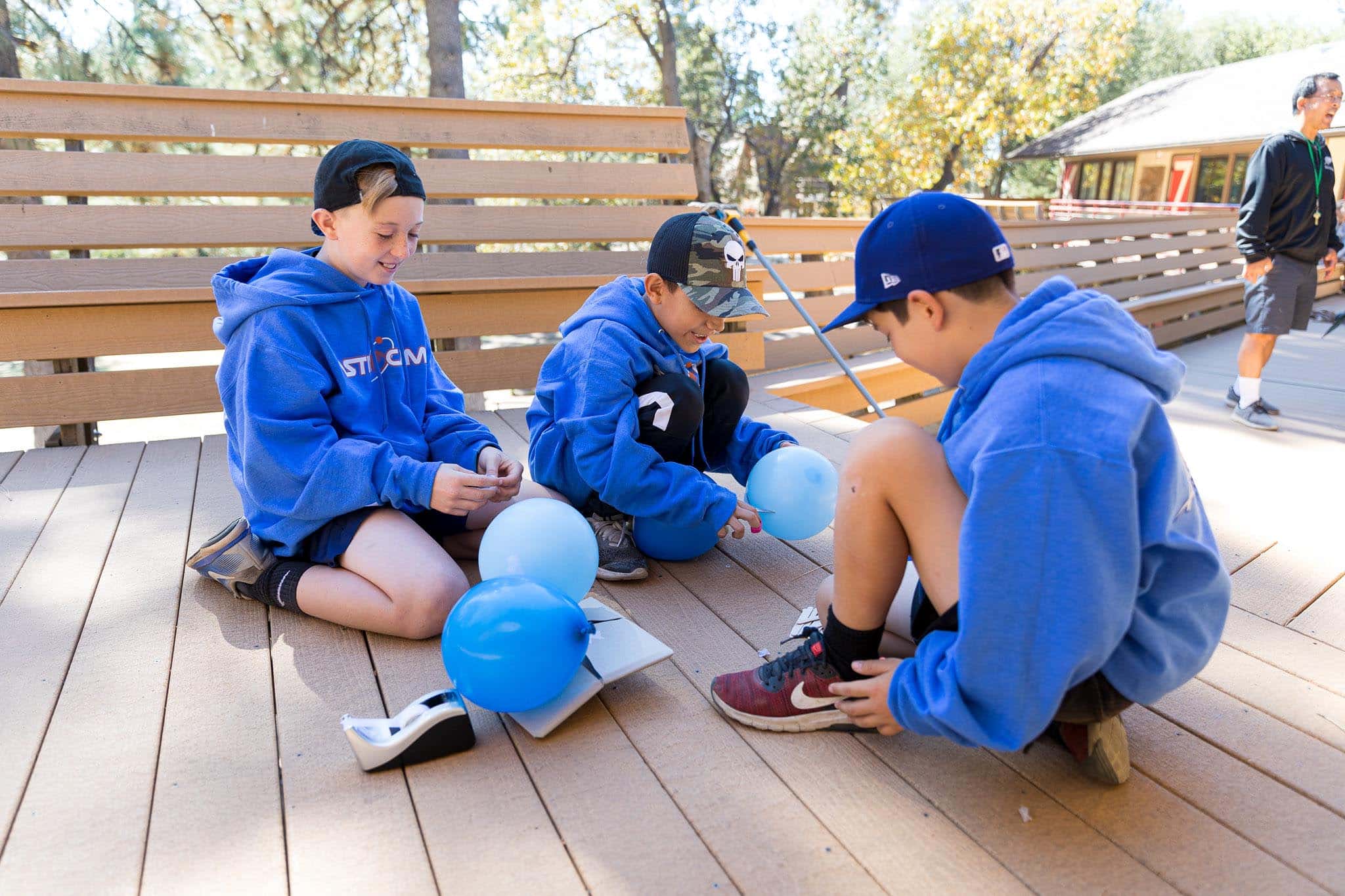 Boys playing with balloons.