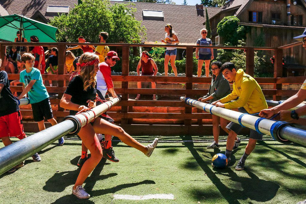 People playing human foosball.