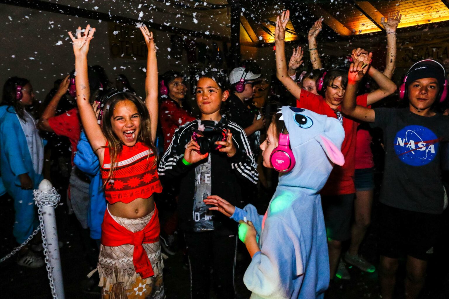 Kids in costumes cheering.