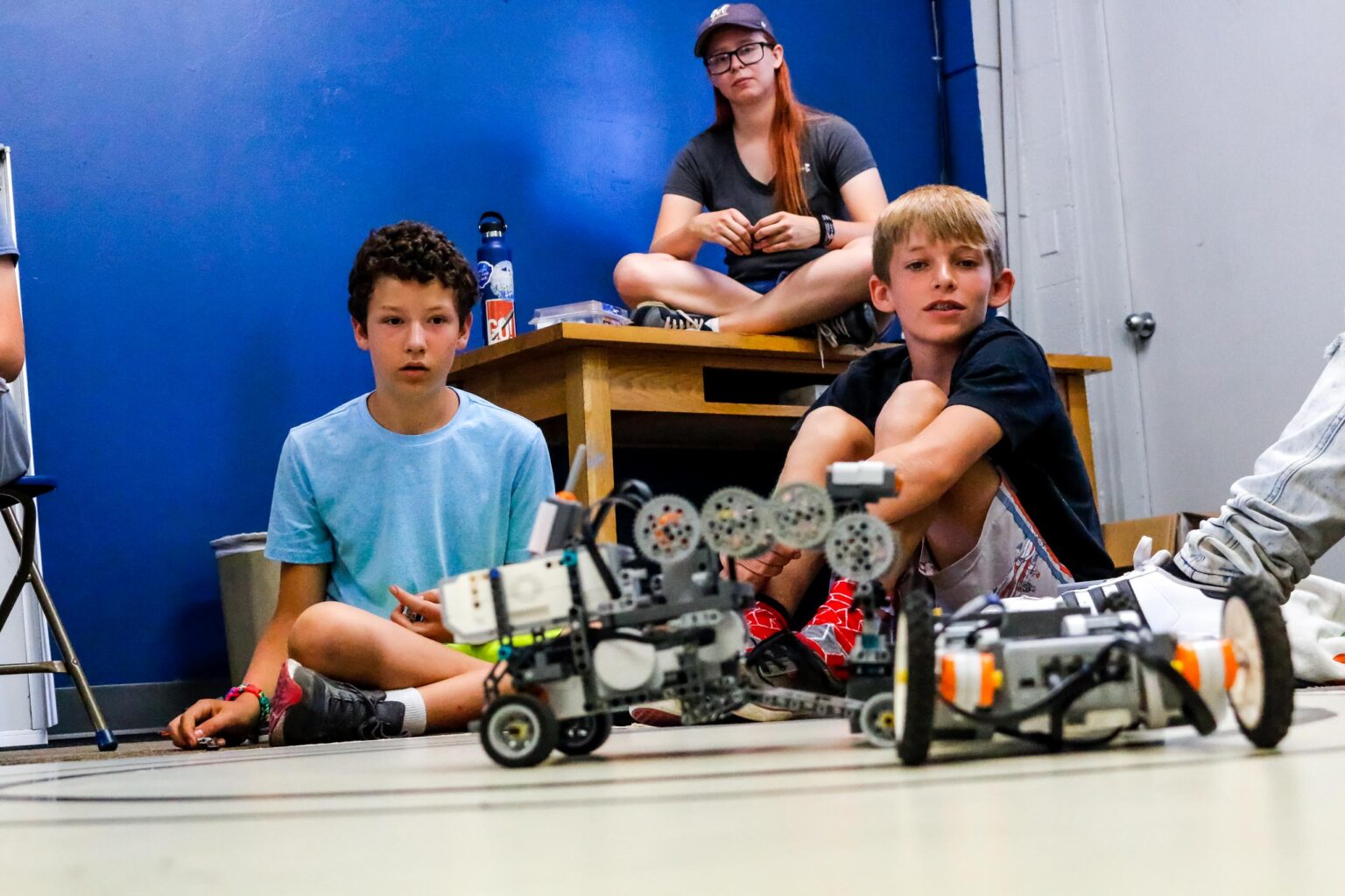Robotics on the ground with boys.