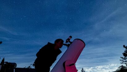 Telescope and night sky.