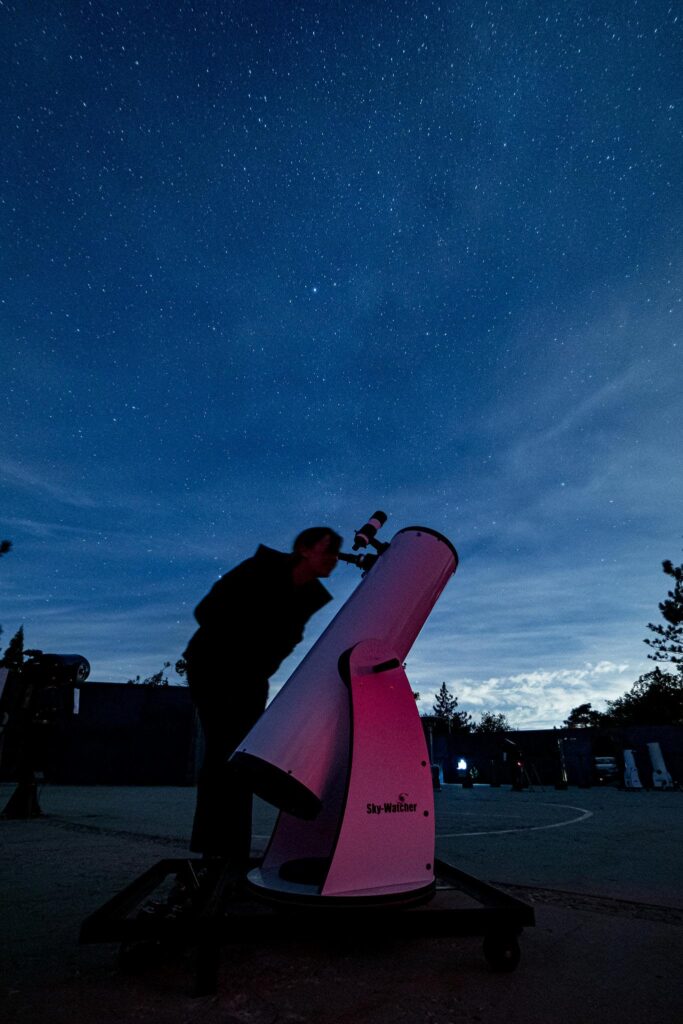 Telescope and night sky.