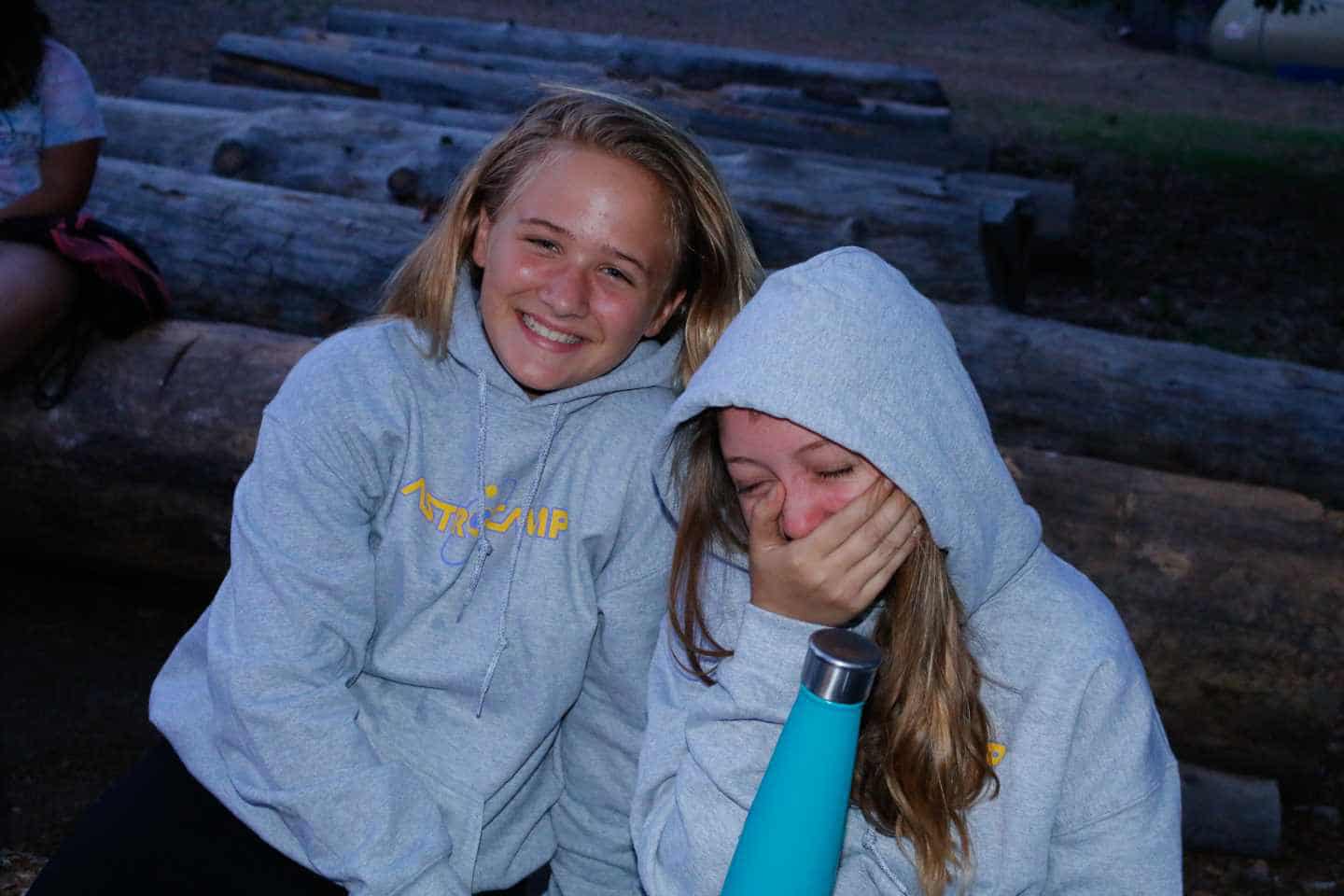 Two girls laughing.