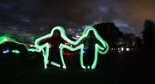 Two people with neon outline.