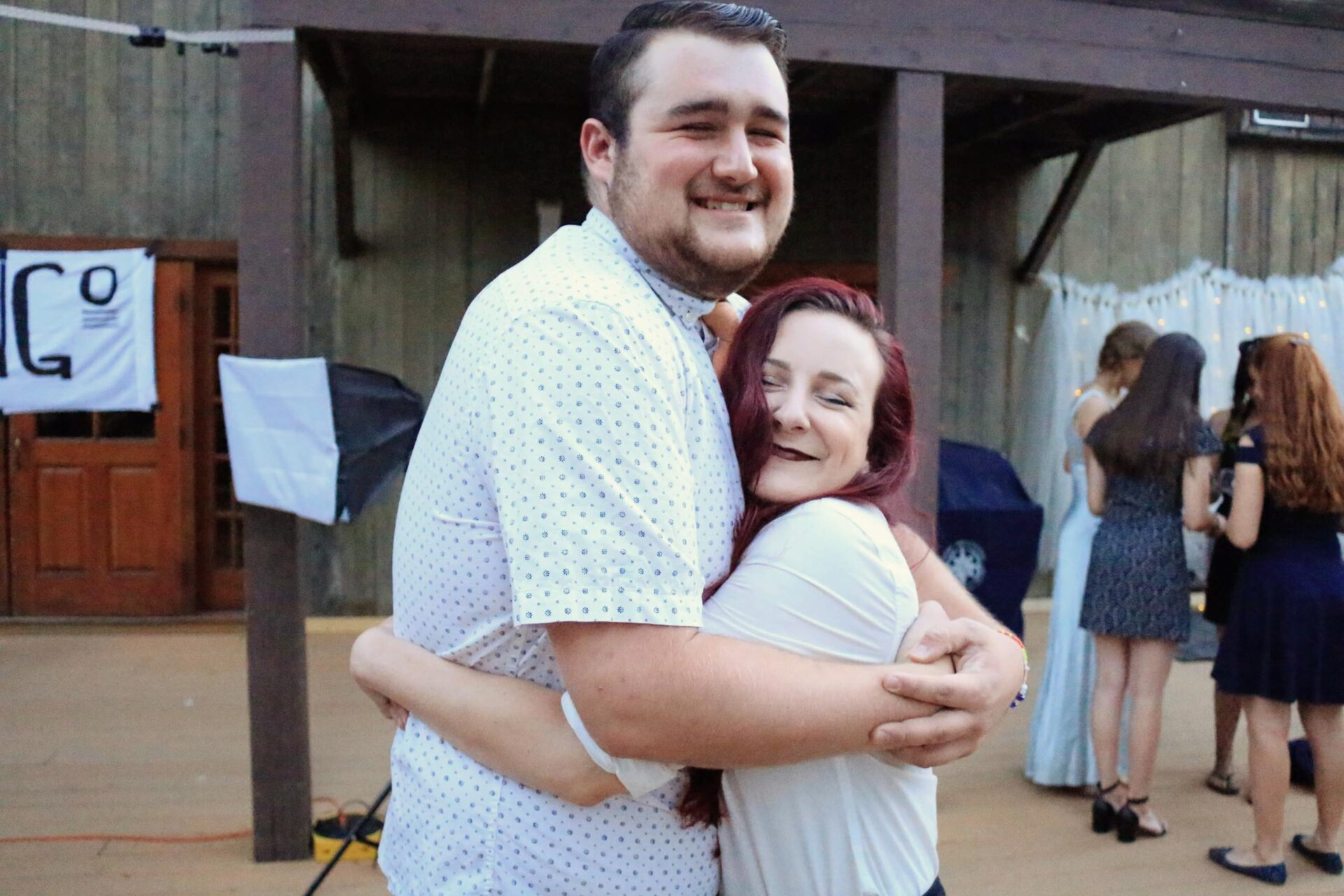 Staff hugging.