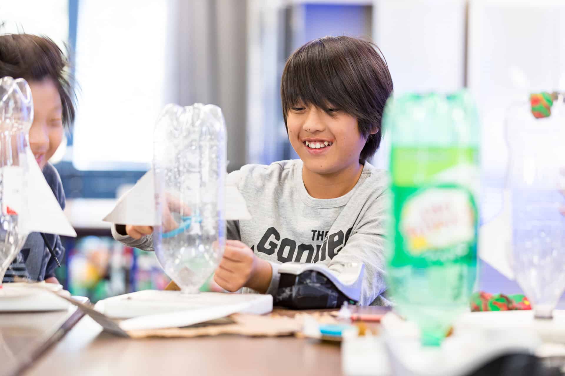 Camper building a rocket from a 2-liter bottle during STEM Explorers activity at AstroCamp.
